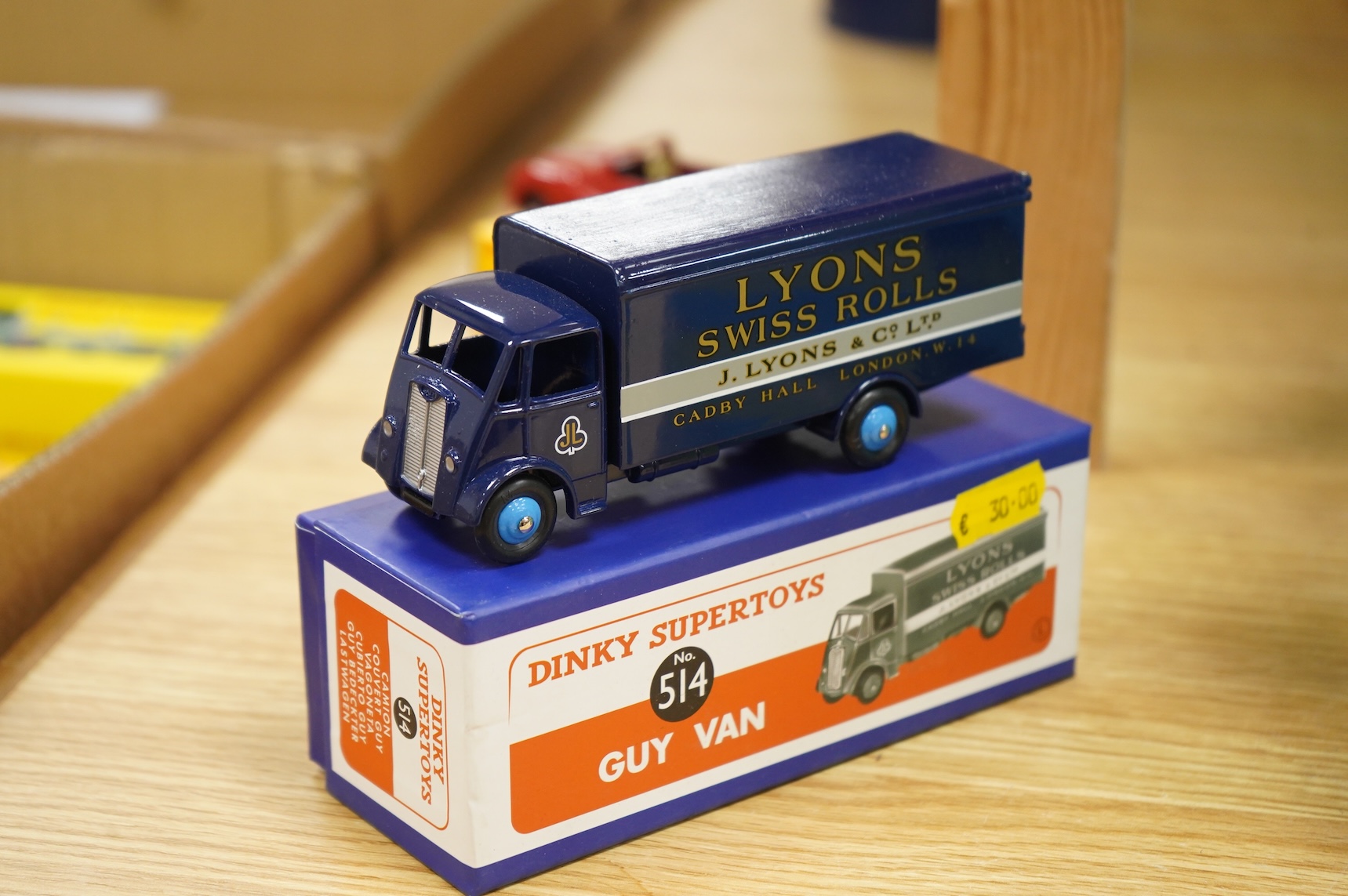 Twenty-two boxed Atlas Dinky Toys, including cars and commercial vehicles, Leyland tankers, a Foden wagon, sports cars, etc.